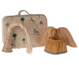Fairy clothes in suitcase - little sister
